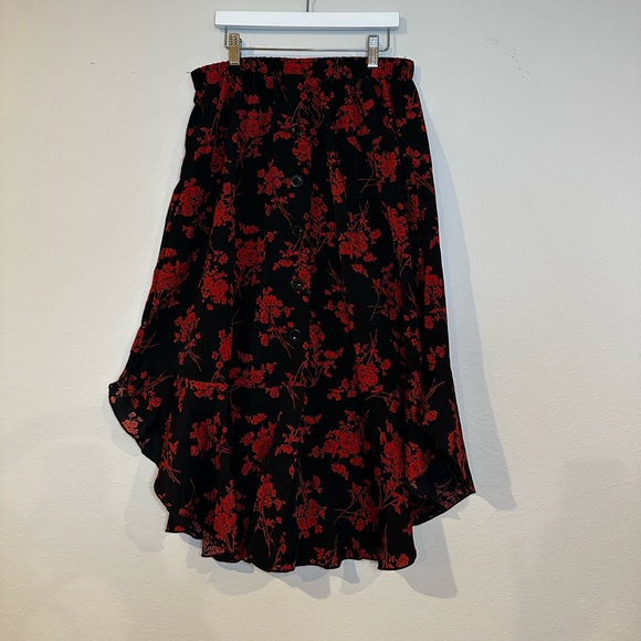Black with red jagged edge, midi skirt, and a women’s size large. - Picture 1 of 3